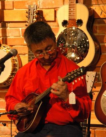 playing mandolin at Olde Town Pickin'
                          Parlor: Ernie Martinez: Bands, Singers,
                          Songwriters / Composers, Solo Performers,
                          Sidemen, Instrumentalists, Performers,
                          Entertainers, Musicians